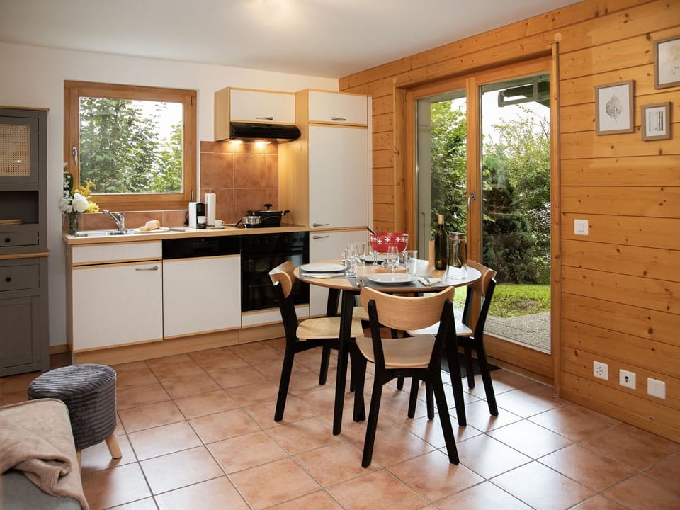 Furniture, Kitchen, Wood, Interior Design, Flooring, Countertop, Cabinetry, Floor, Kitchen & Dining Room Table, Wood Stain