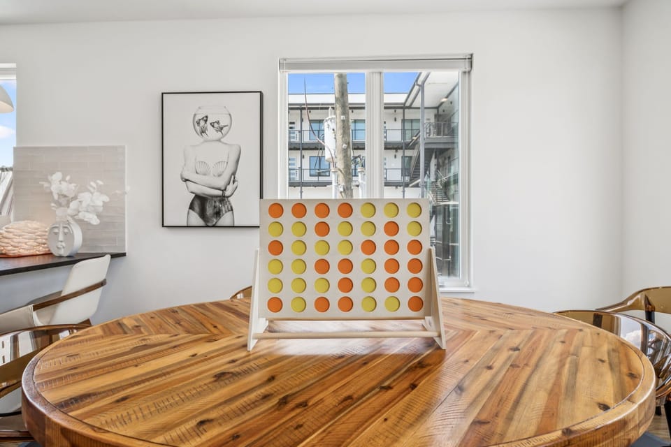 Dining Area: Dine in style! The chic and modern design of this dining area, complemented by the open-concept kitchen, makes it the perfect setting for making memories with friends and family.