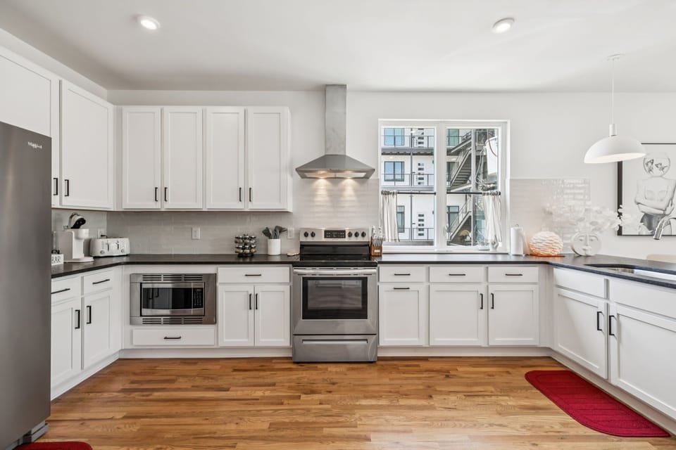 Kitchen: Start your day with coffee and sunshine in this inviting kitchen. A perfect space to gather and create culinary memories.