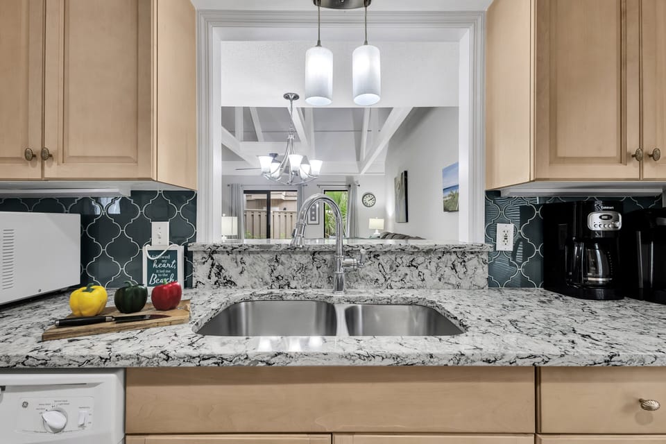 Experience the ease of cooking in our streamlined galley kitchen, where everything you need is within arm's reach.