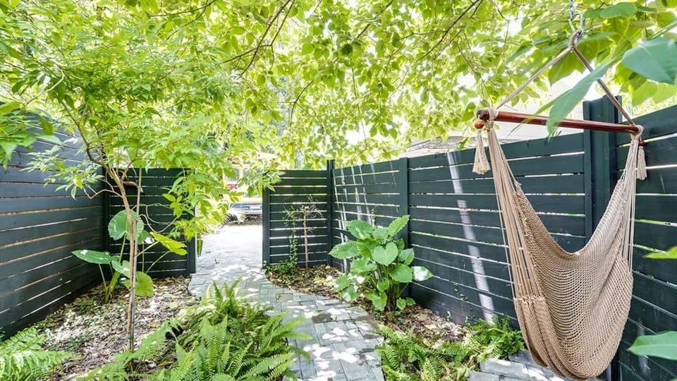 Follow the stone path through a peaceful, garden-lined entrance that sets the tone for a tranquil escape. The private hammock nook is perfect for slowing down and savoring the moment.