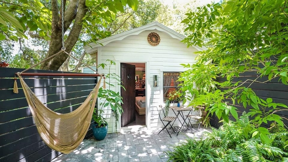 Surrounded by lush greenery, this private patio invites you to sway in the hammock, enjoy a peaceful meal, or simply soak in the natural beauty right outside your door.