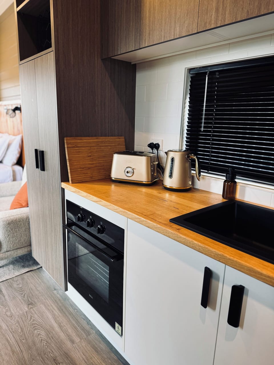 Full size oven, pantry with hidden microwave, toaster & kettle.
