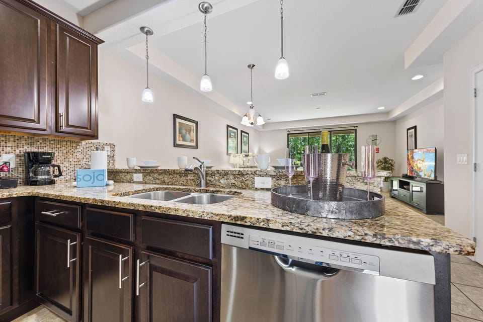 Breakfast bar with seating for three for casual meals or chatting while cooking.