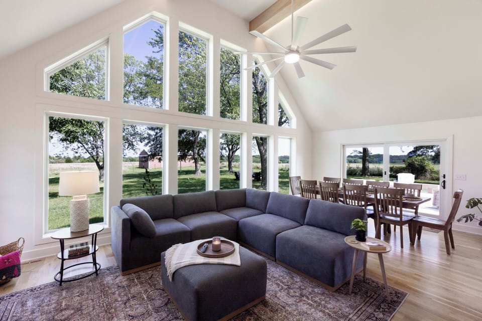 Relax in the spacious living area with scenic views of the hilltop.