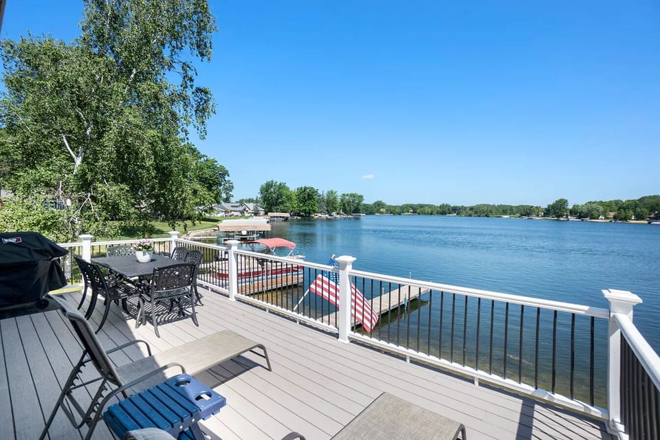 Balcony with grill, lounge chairs, and dining table