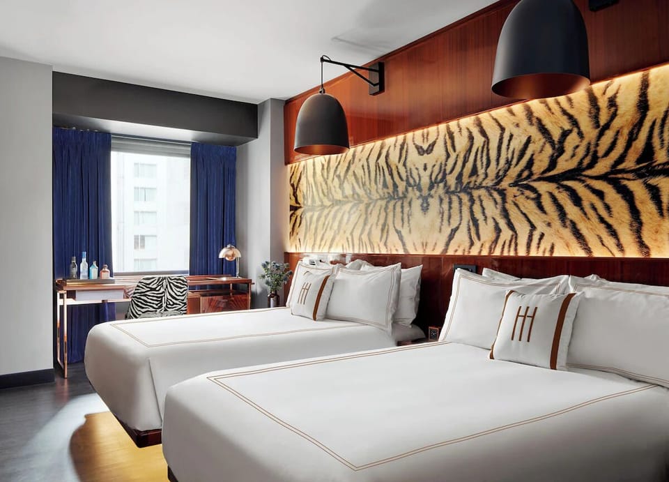 Stretch out together in twin beds with standout designer décor.