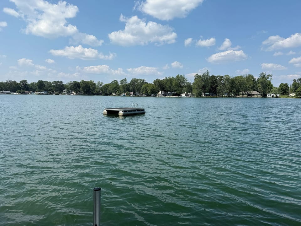 Floating dock, can lay out by the water. Has a ladder to get up.