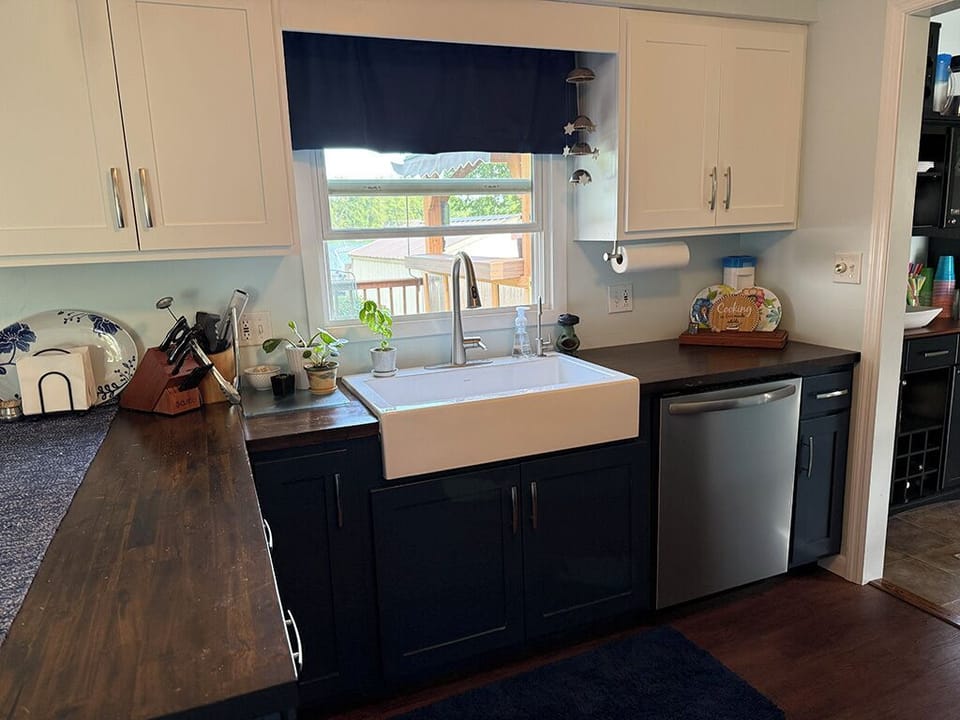 Large basin farm sink. Wood countertops. Dishwasher and microwave.
