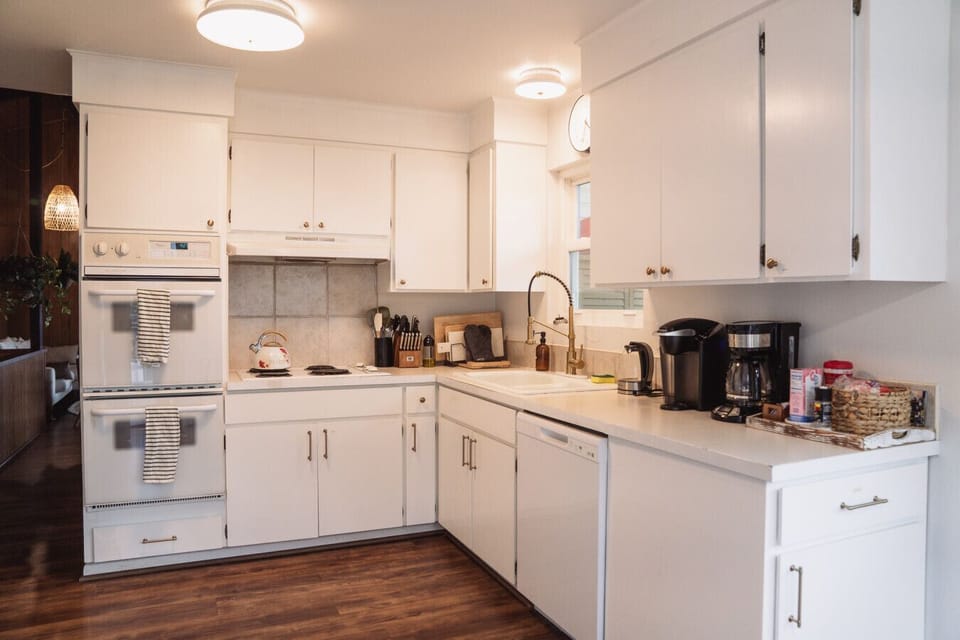 Kitchen equipped with essential appliances.