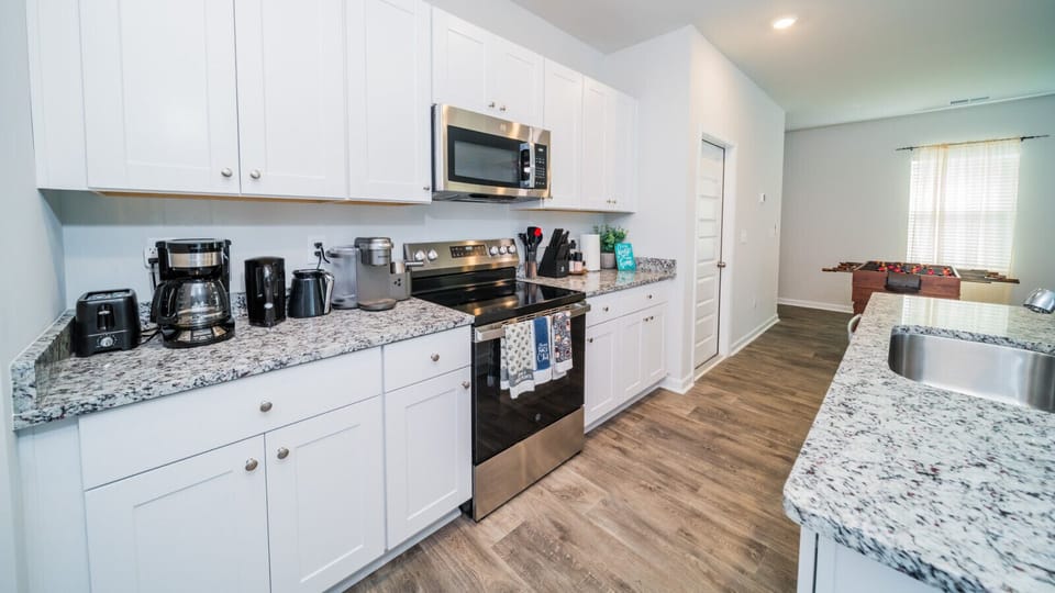 Kitchen with full amenity
