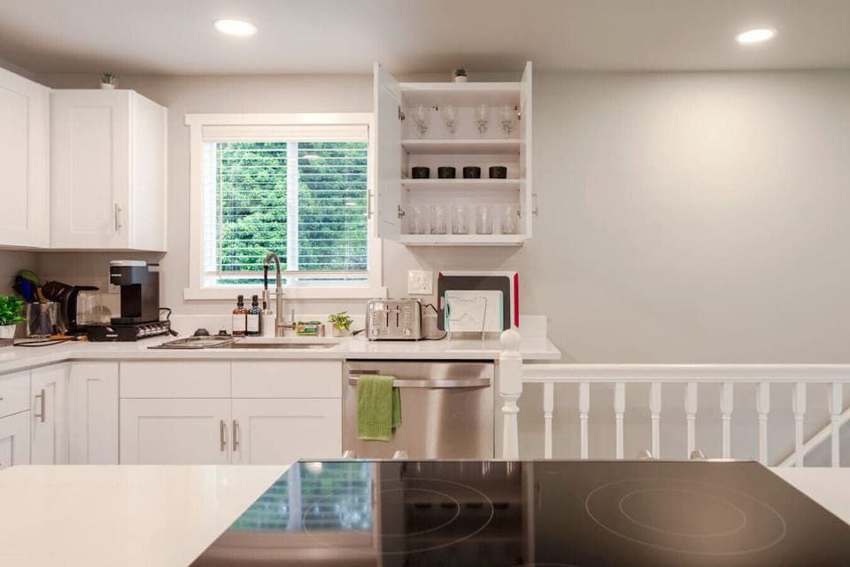 Our modern open kitchen is thoughtfully designed and well-equipped, providing a functional space