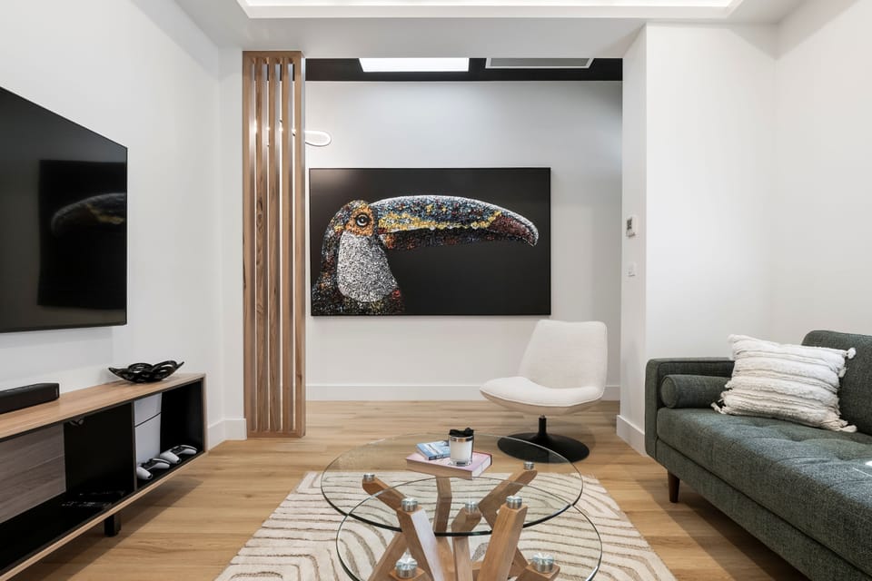 LOUNGE: The large lounge with comfortable generous couch and designer furniture has a large screen smart TV, bluetooth sound bar and Playstation.