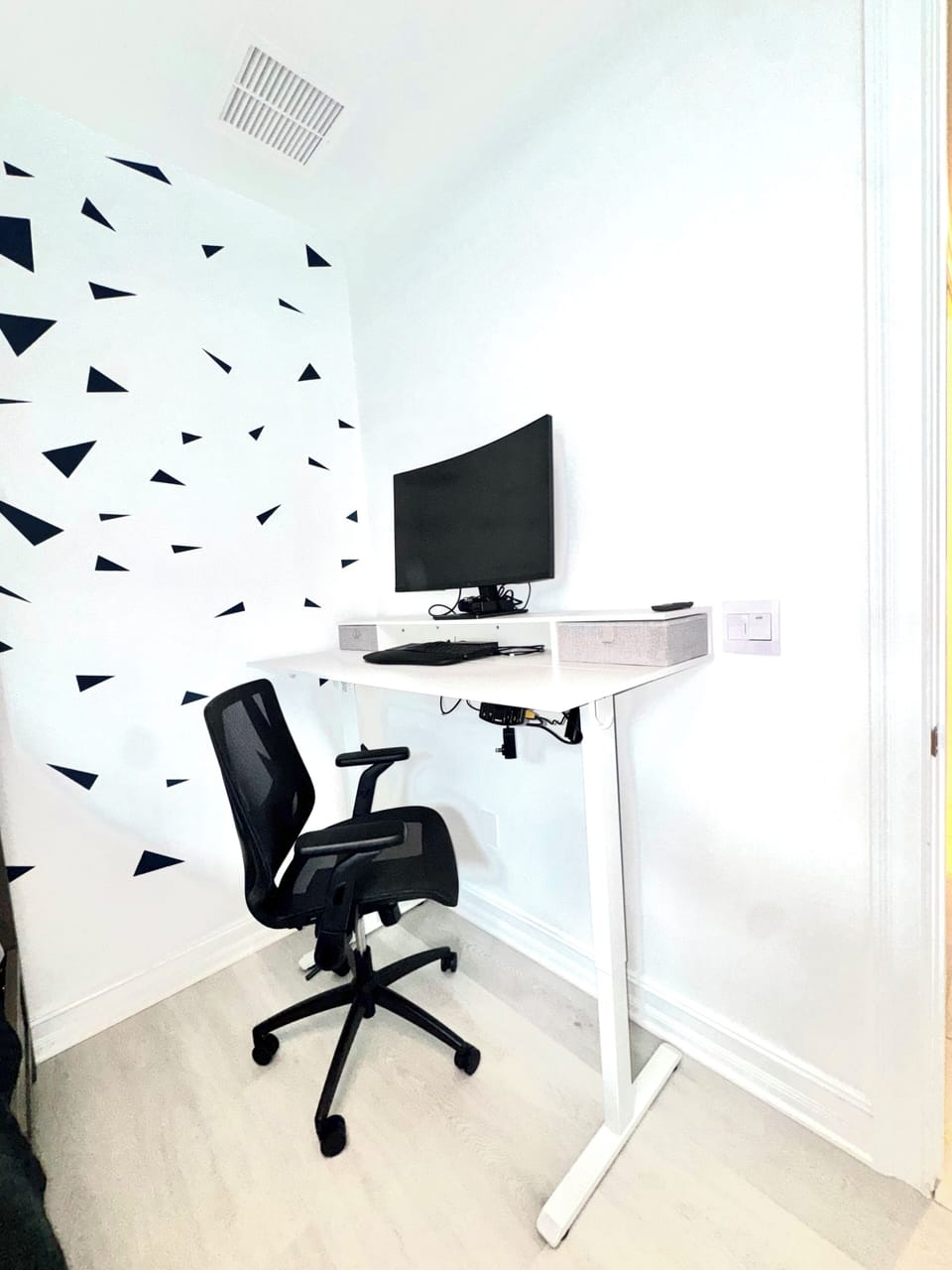 Adjustable Desk Sit or Stand with Monitor in Guest Bedroom
