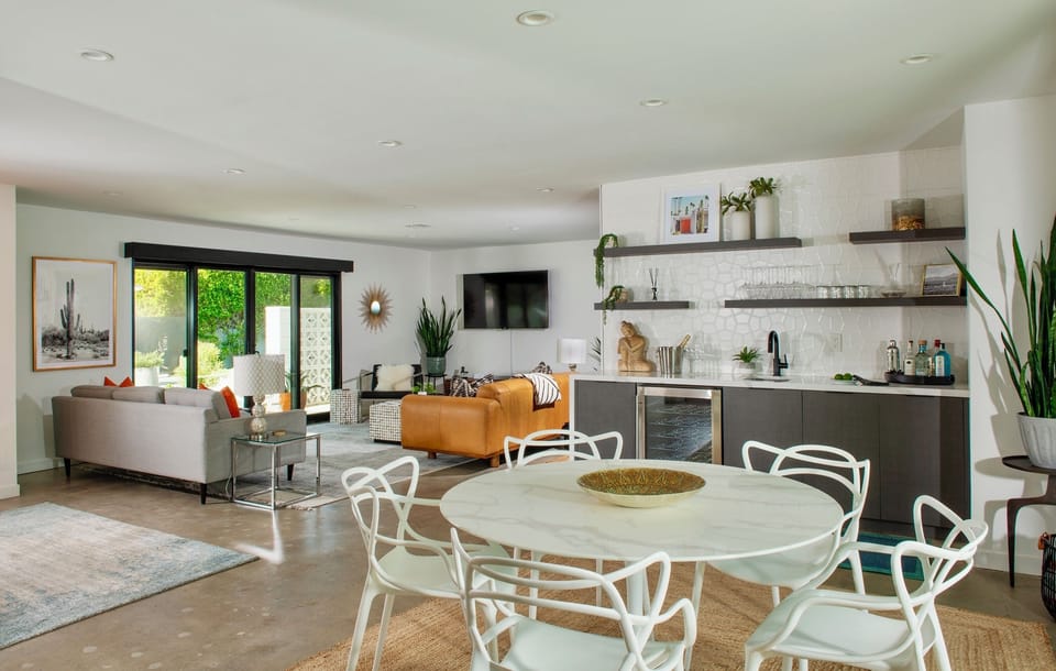 Open great room + wet bar; wine fridge, glassware—perfect for happy hour