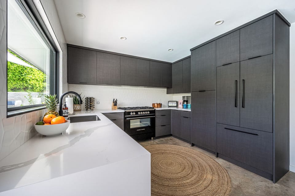 Remodeled kitchen: quartz counters, Fisher & Paykel; fully stocked for cooking