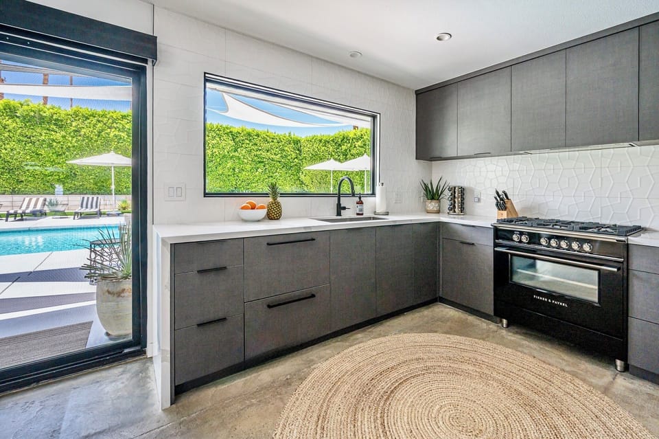 Open kitchen/dining and new appliances, fully stocked, tile backsplash, gas oven