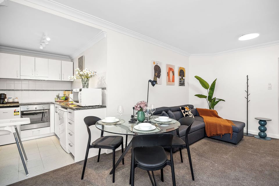 Discover our bright, inviting open-plan area seamlessly connecting a fully-equipped kitchen and a stylish dining area with a comfortable living room.