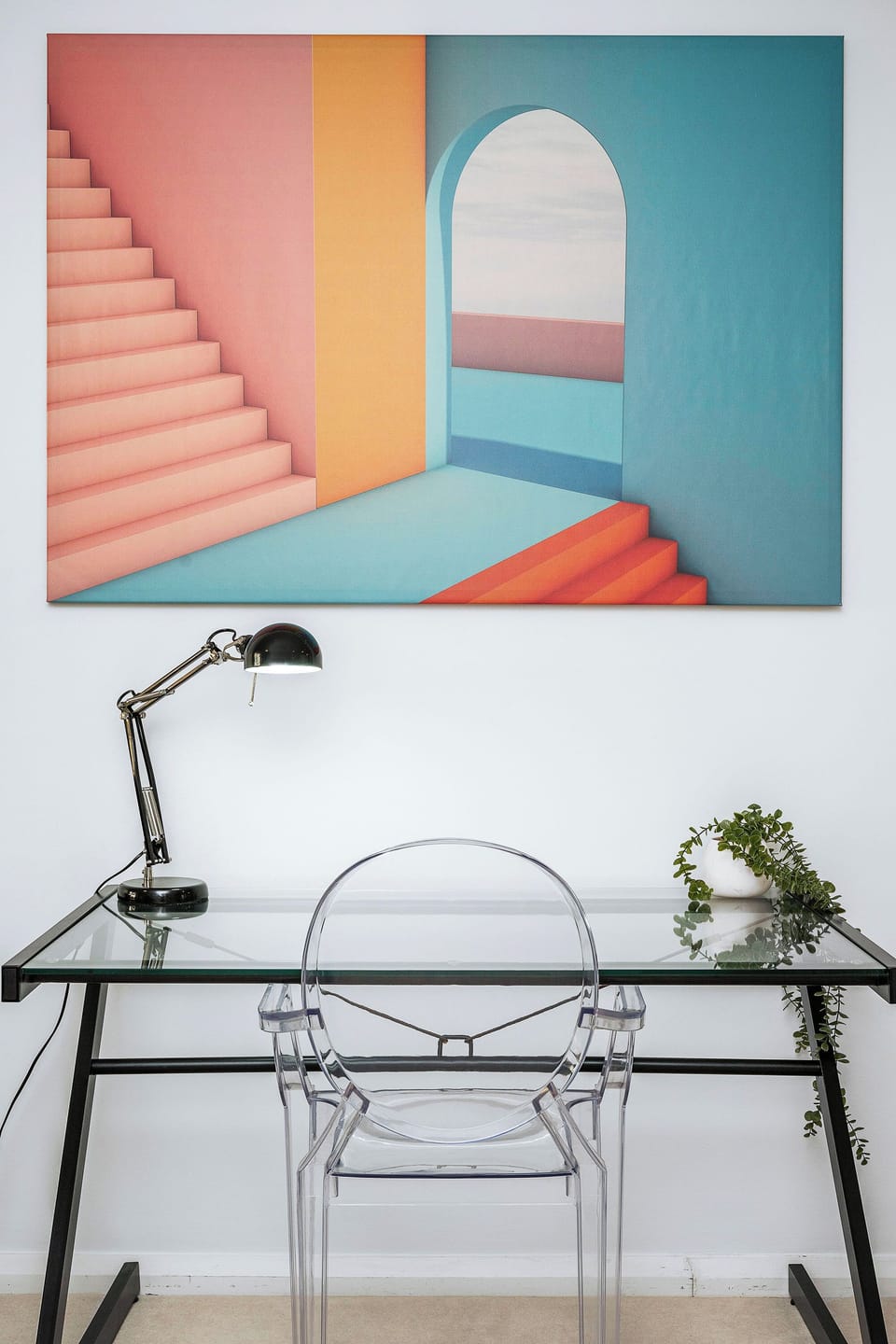 Functional desk with natural light and greenery, perfect for remote work.