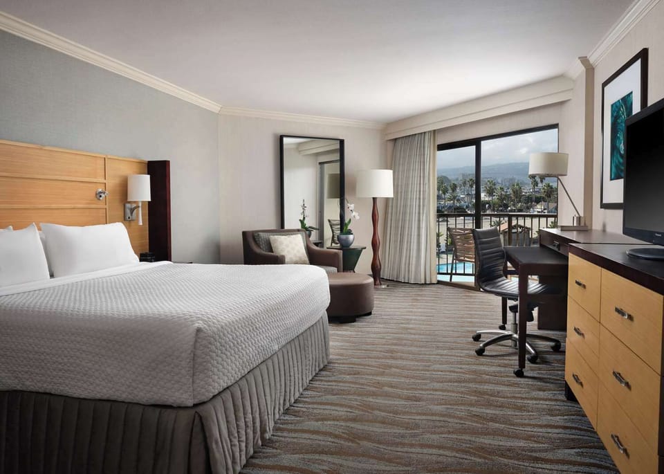 Enjoy sunset light from your room with balcony seating.