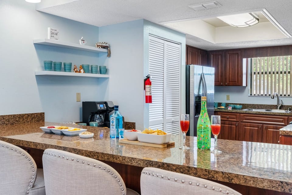 The countertops are made from gorgeous granite, offering a durable and heat-resistant surface for meal prep.