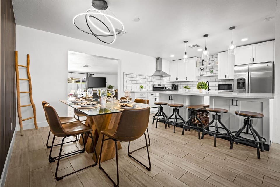 Our modern kitchen flows seamlessly into the dining area, making it easy to prep meals while staying part of the conversation. Whether it's a casual breakfast or a group dinner, this space brings everyone together.