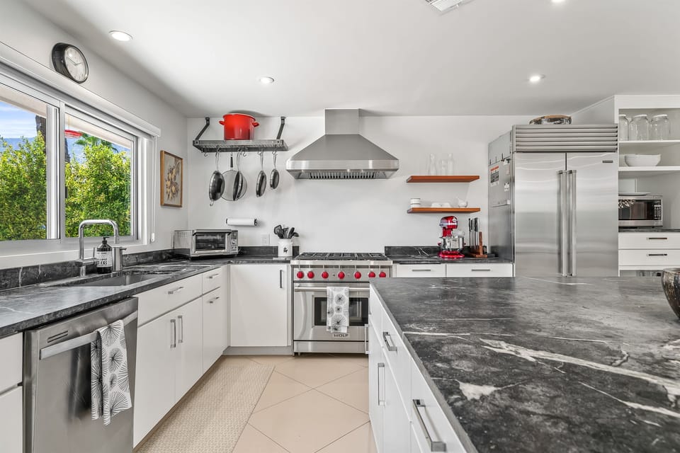 Wolf gas cooktop, Subzero, deep stainless sink and plenty of storage