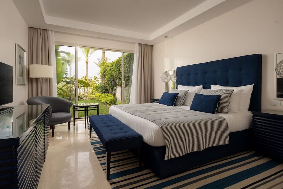 Linger in plush comfort with leafy garden views outside