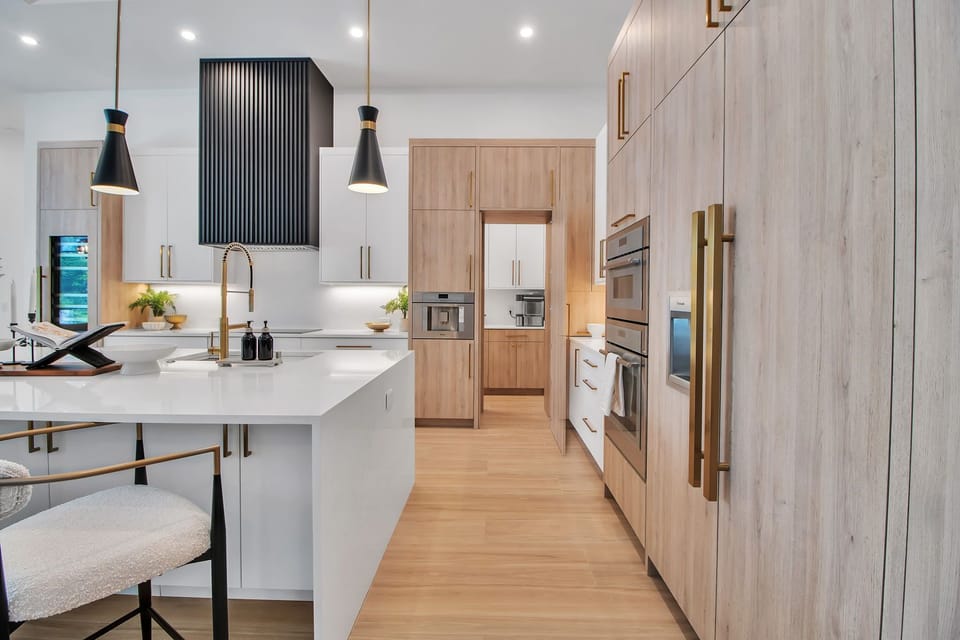 Gourmet kitchen with gas range & wood cabinetry