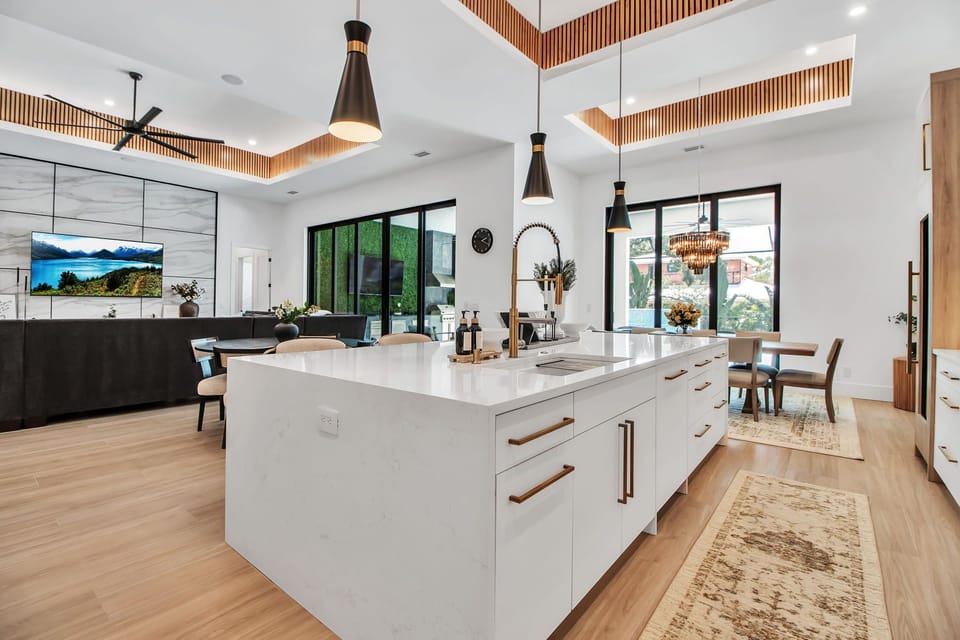 Bright kitchen island with waterfall countertop