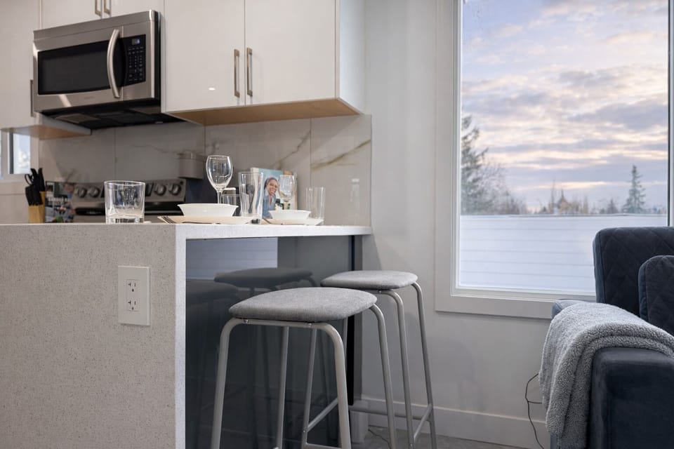 Start your day with fresh coffee in this cozy kitchen nook.