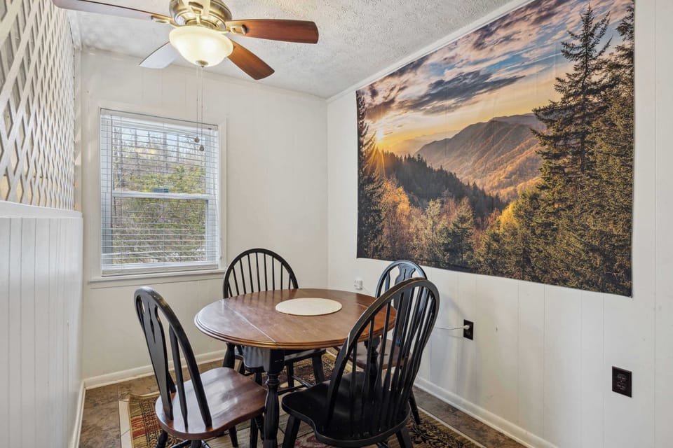 Dining/game table with seating for 4 in unit B's bedroom 1