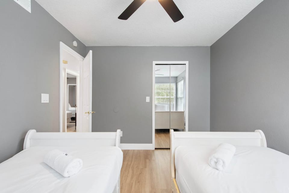 Bright, comfortable twin beds in a modern room. (