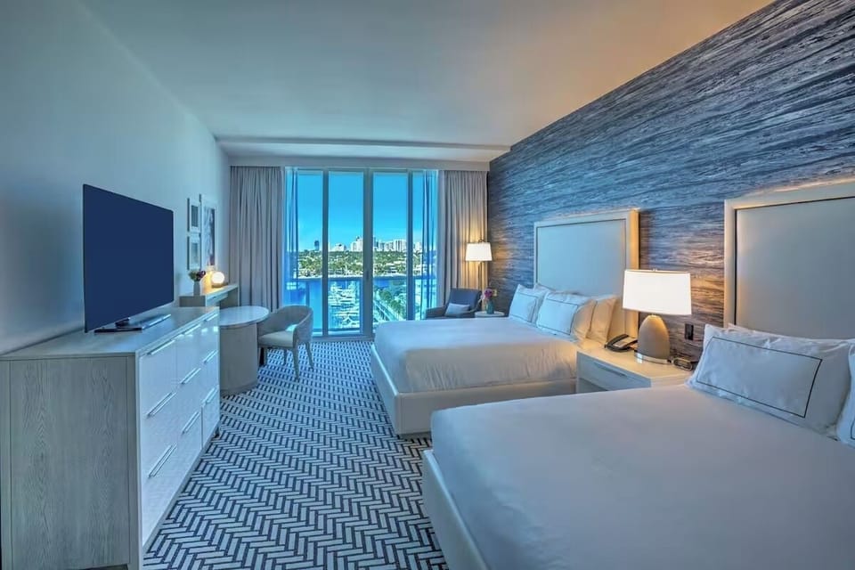 Stretch out in a bright double-queen room with balcony views.