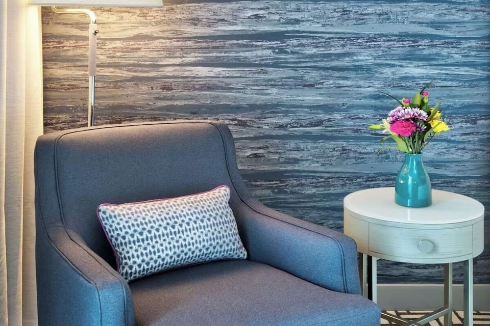 Sip and relax in a quiet corner beside fresh flowers.