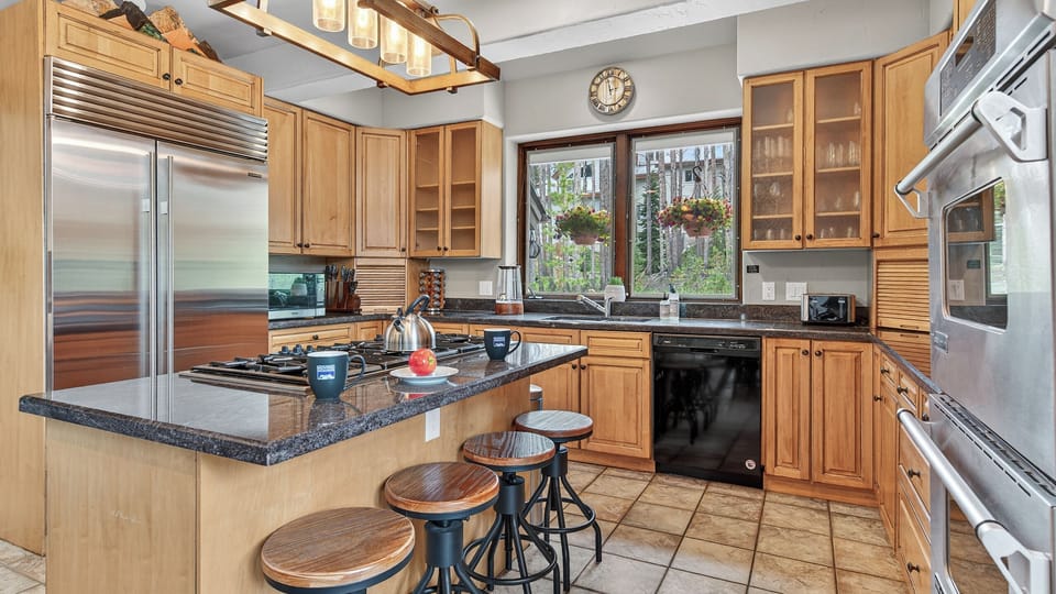 Kitchen, Main Level - With island bar stools