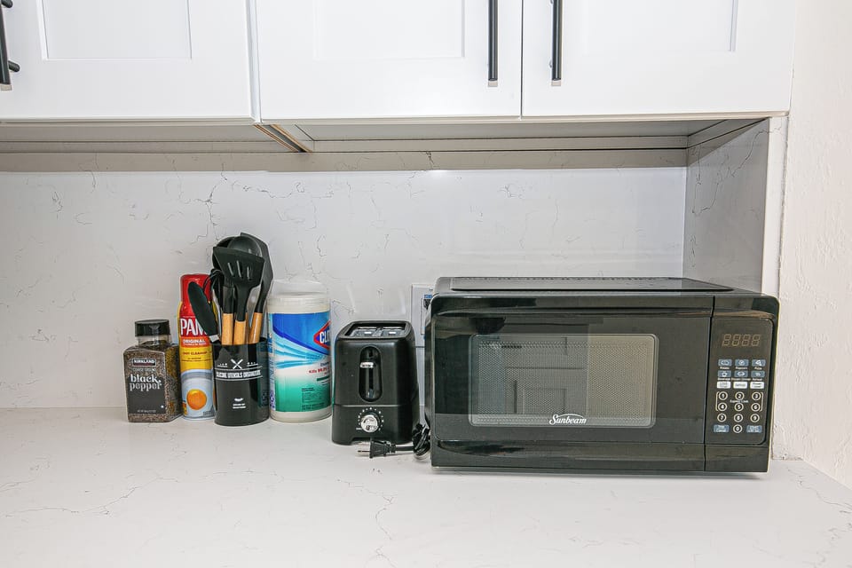 Microwave, toaster, utensils