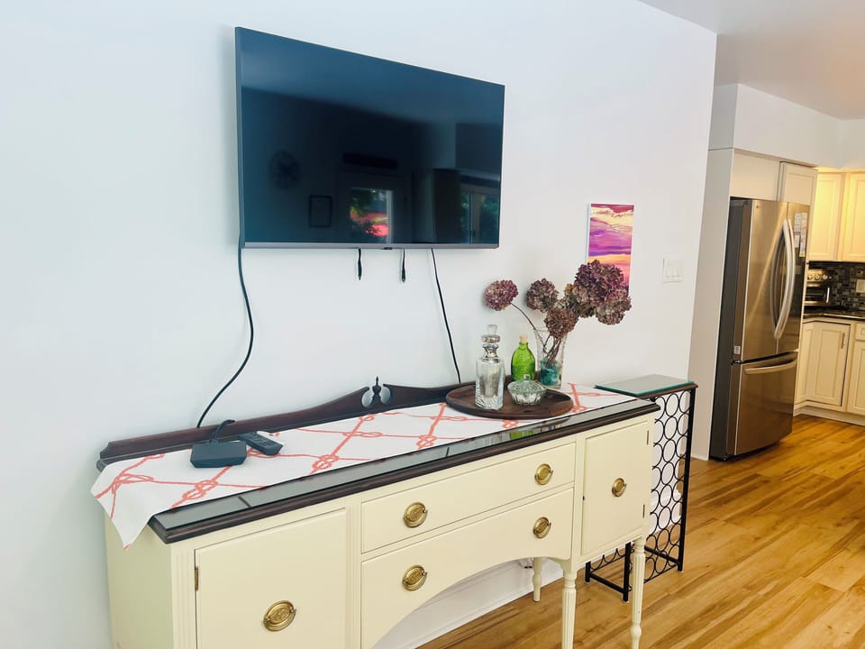 Buffet and flat screen TV in dining area