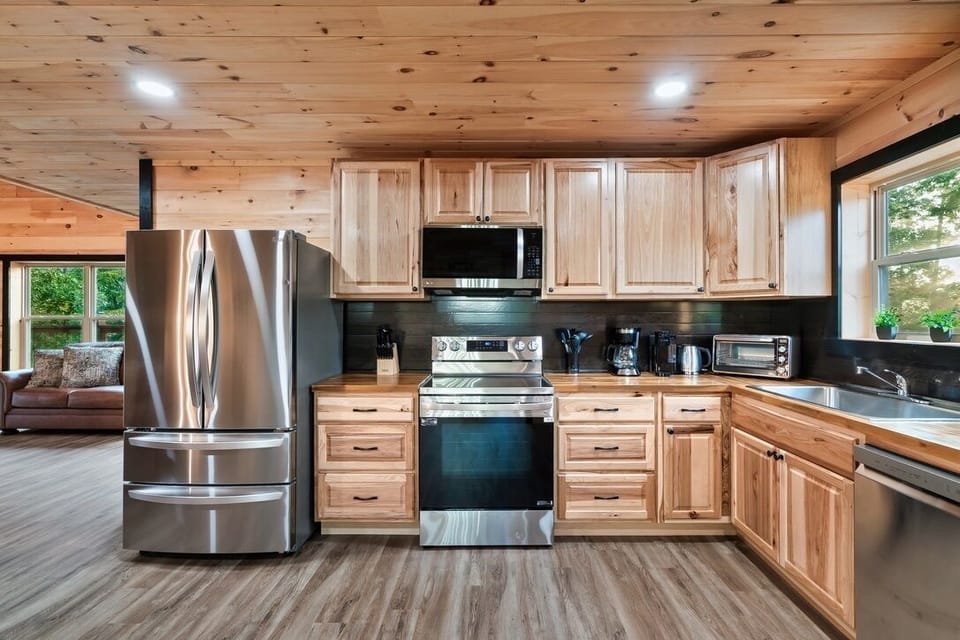 Second-floor kitchen with front deck access and mountain views