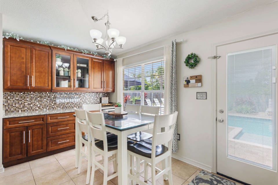 Dining area near the pool door for easy indoor-outdoor meals