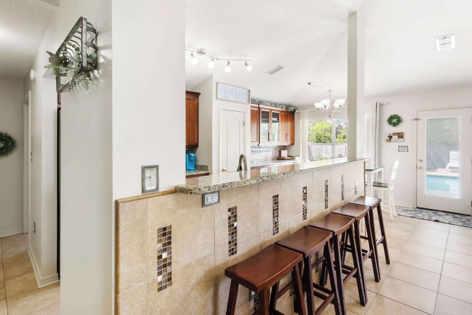 Kitchen island seating with pool views