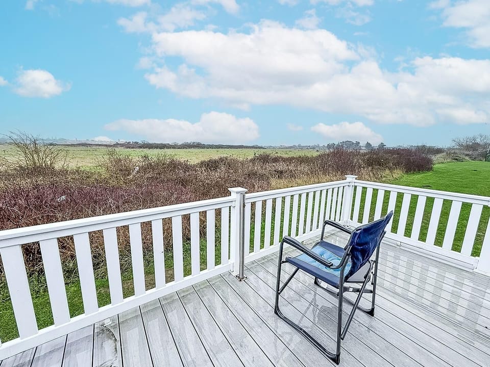 A sunny afternoon in Clacton-on-Sea is best spent relaxing on the private decking this holiday home.