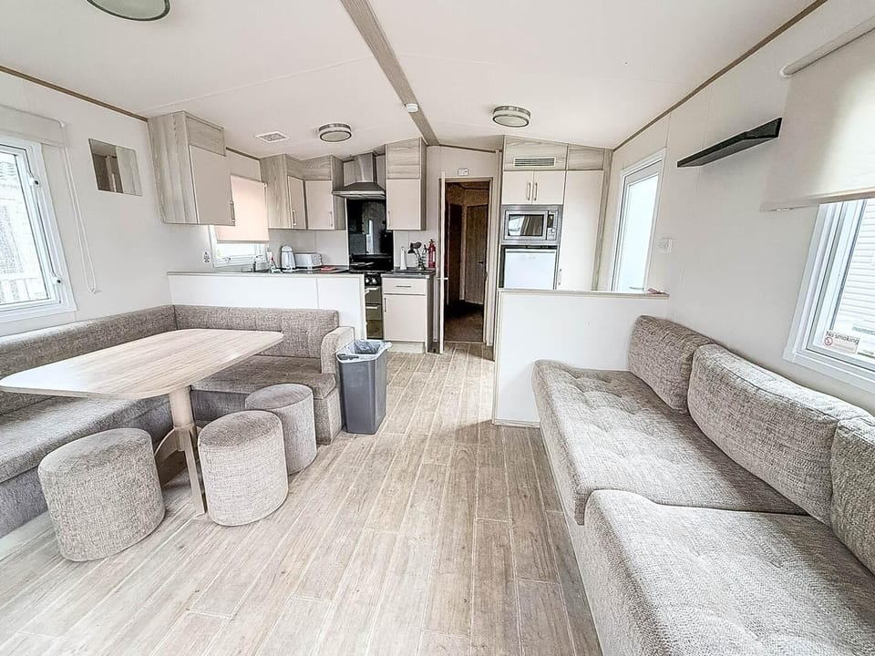 The holiday home living room is the perfect spot to enjoy a cup of coffee in the morning.