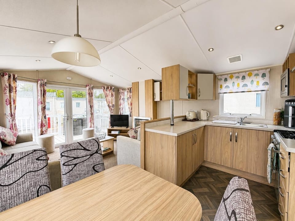 The caravan living area is perfect for quality time, board games, or simply putting your feet up with a cup of tea while recounting the day's adventures.