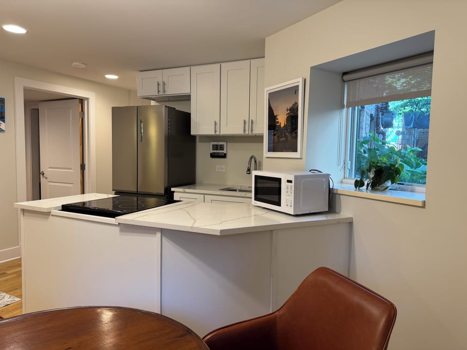 new kitchen with double door refrigerator and electric range and oven