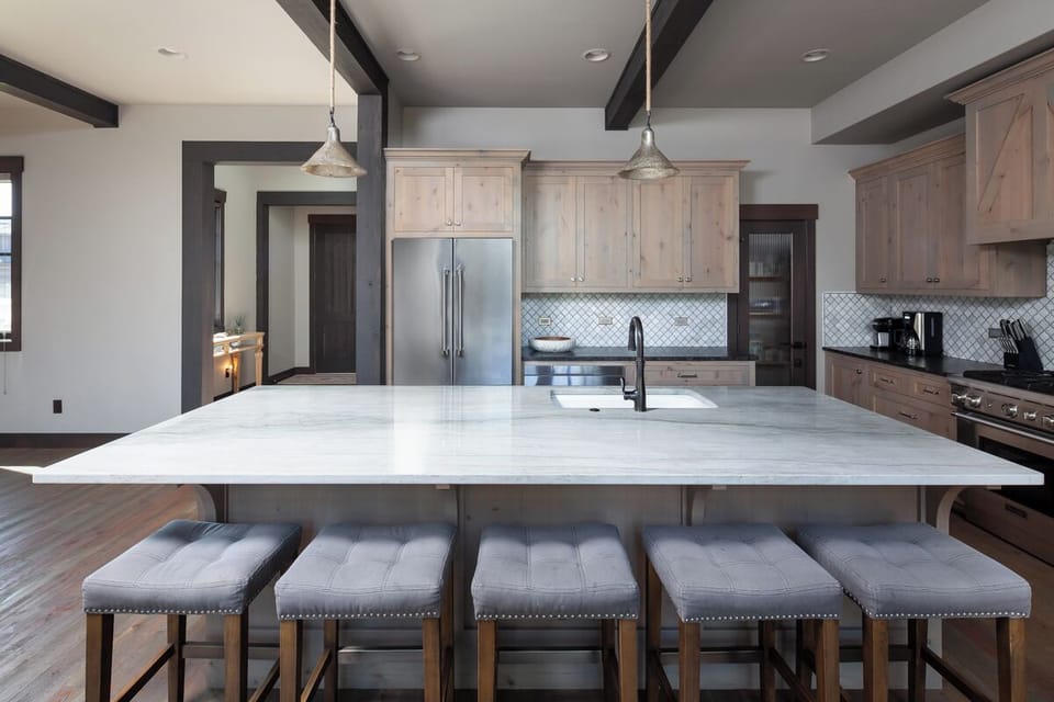 Serve snacks and cocktails at the sleek island seating.