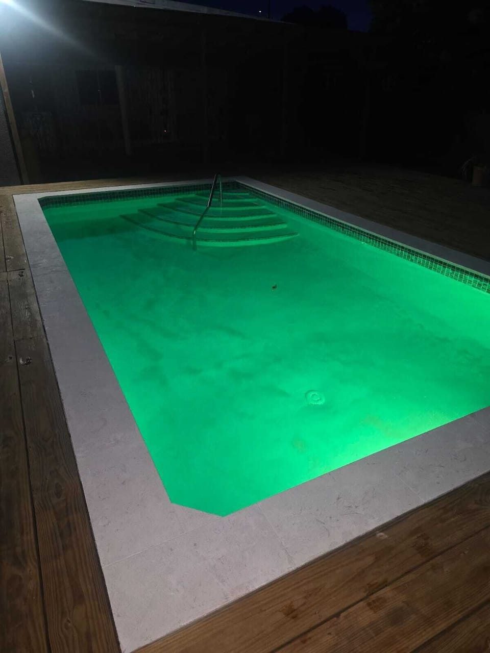 pool lights on in the night