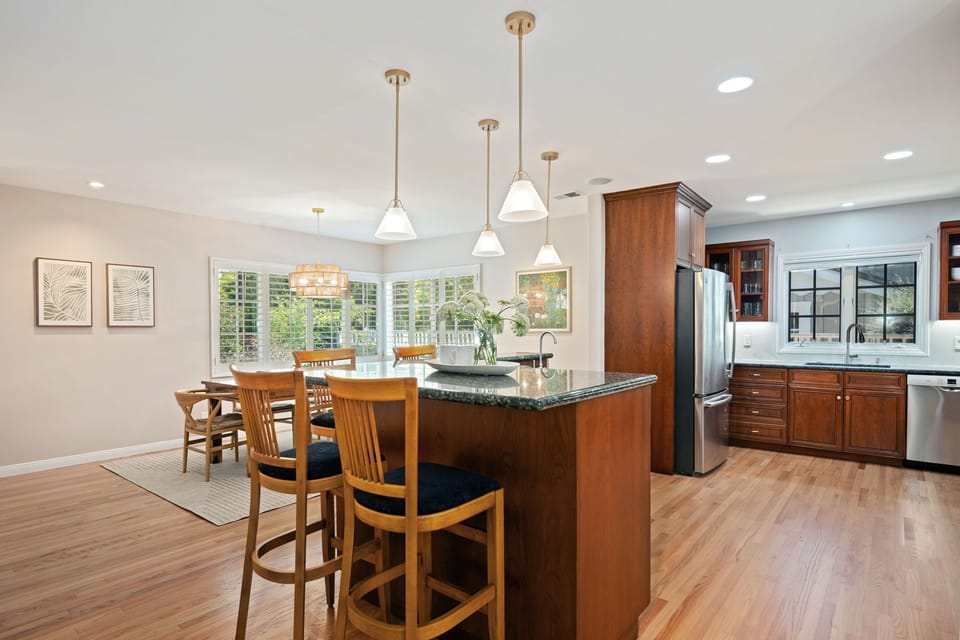 The kitchen area flows effortlessly into the dining space