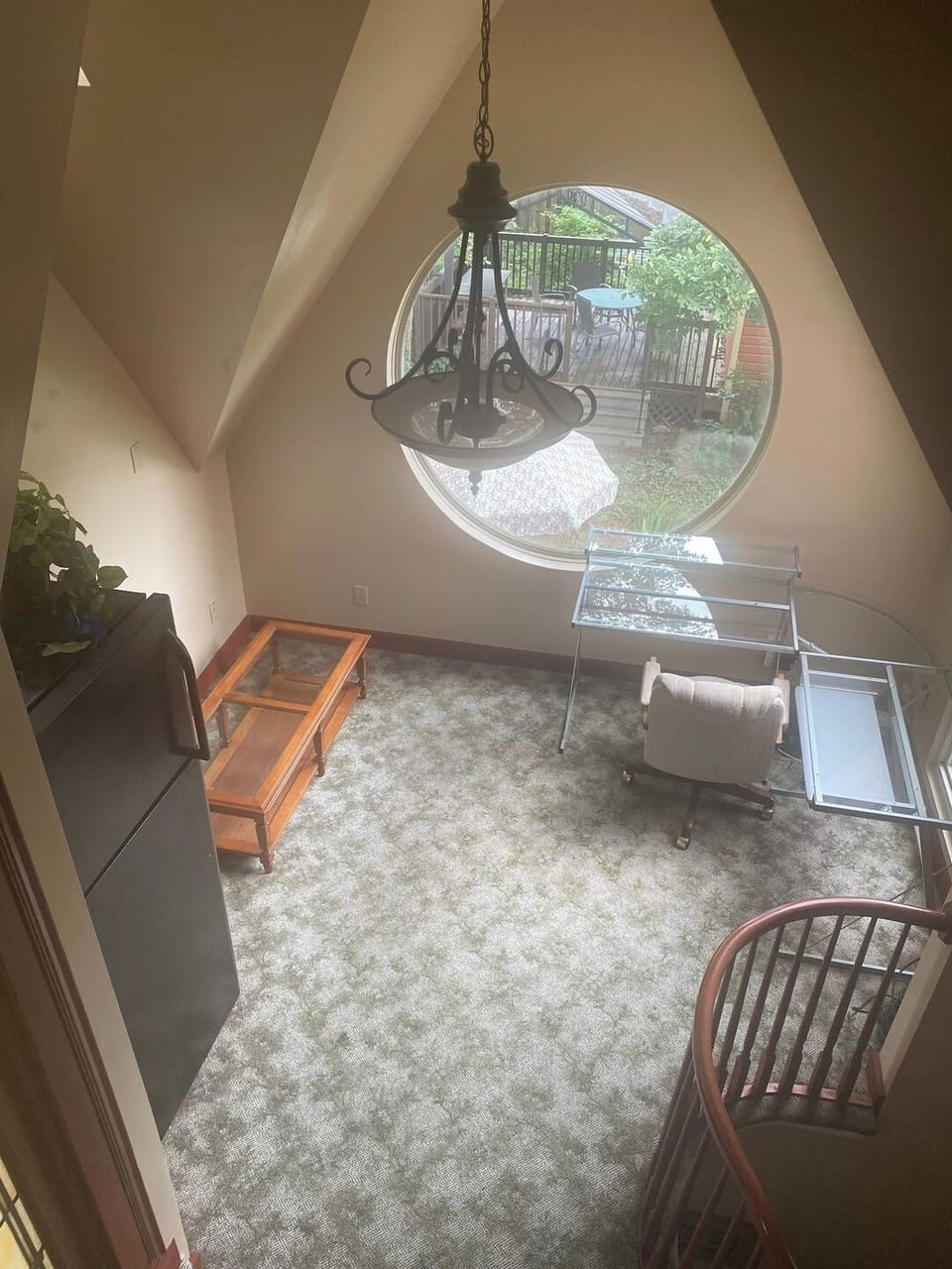 Here is a separate workspace with large round window overlooking the back yard to distract you. 