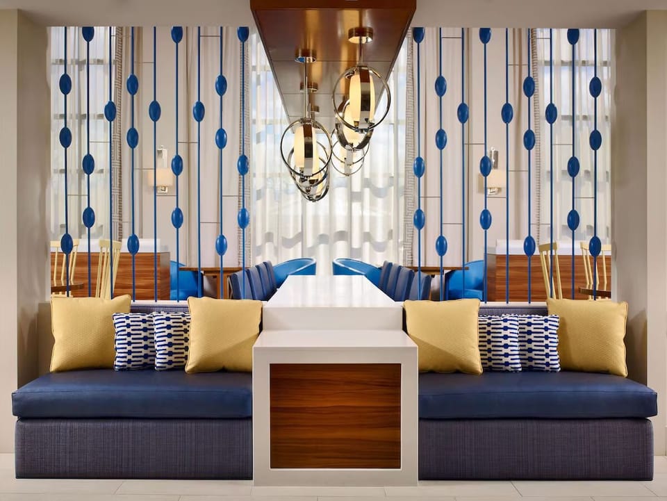 Unwind in a stylish lounge nook with cozy seating.